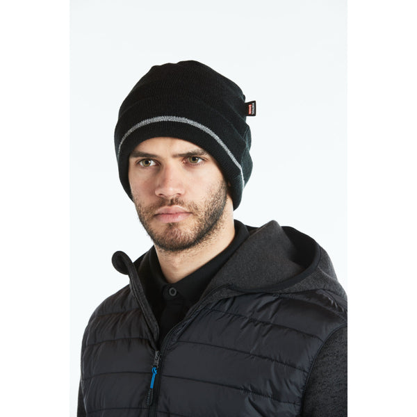 Worker wearing the Portwest Hybrid Baffle Jacket with a hard hat.