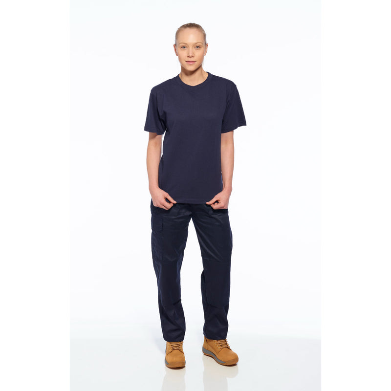 Woman in navy blue T-shirt and cargo pants with tan work boots, standing and facing forward.