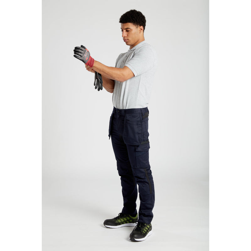 Model wearing Portwest holster trousers and beanie, front view.