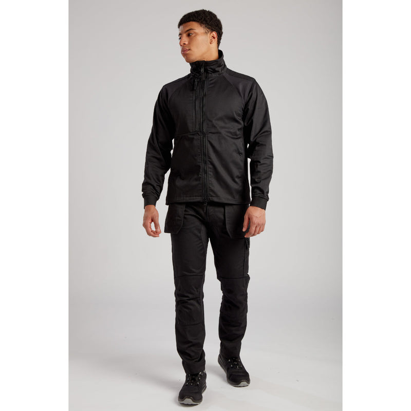 Side pose of worker wearing Portwest Eco Stretch Jacket and work trousers