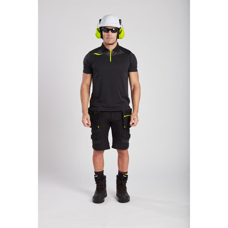 A worker operating machinery while wearing full Portwest safety gear.