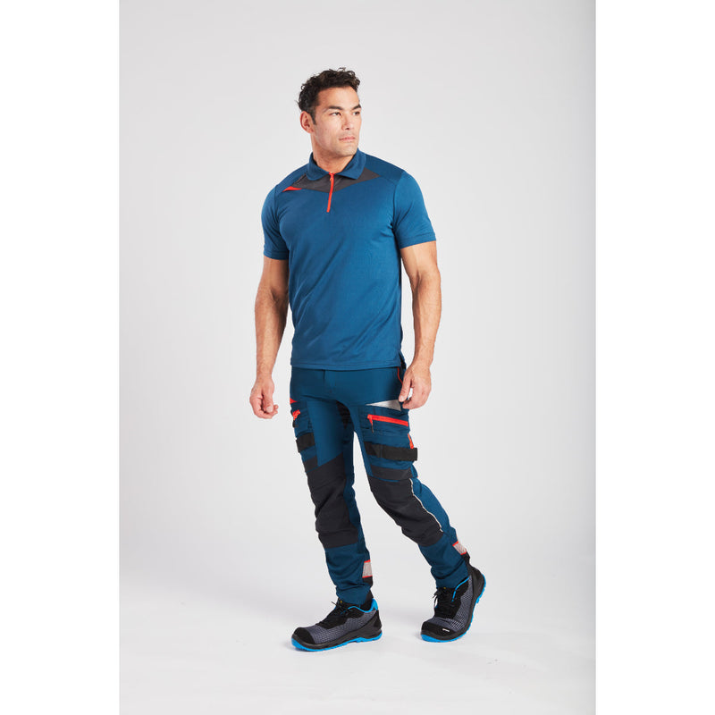 Side view of a worker wearing the Portwest work trousers.