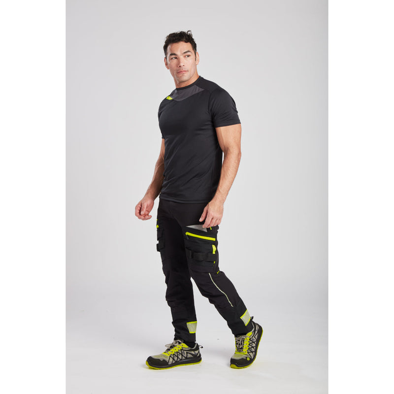 Worker showing the slim, active fit of the work trousers.