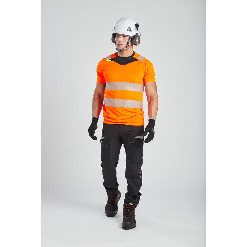 Back view of the model in the yellow Portwest DX4 t-shirt, showing reflective tape design.