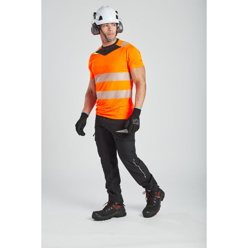 A worker in full Portwest gear, including helmet, gloves, and jacket.