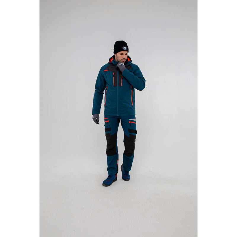Front view of a model wearing the blue Portwest DX4 winter jacket with the hood up.