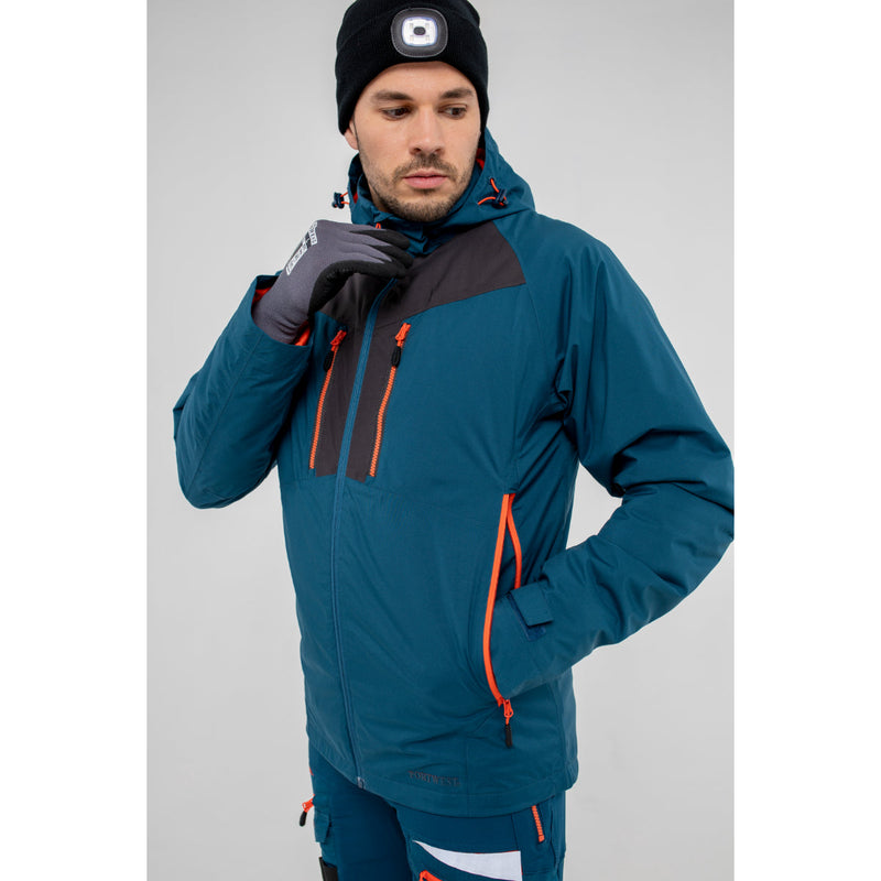 Side profile of a model wearing the blue Portwest DX4 hooded winter jacket.