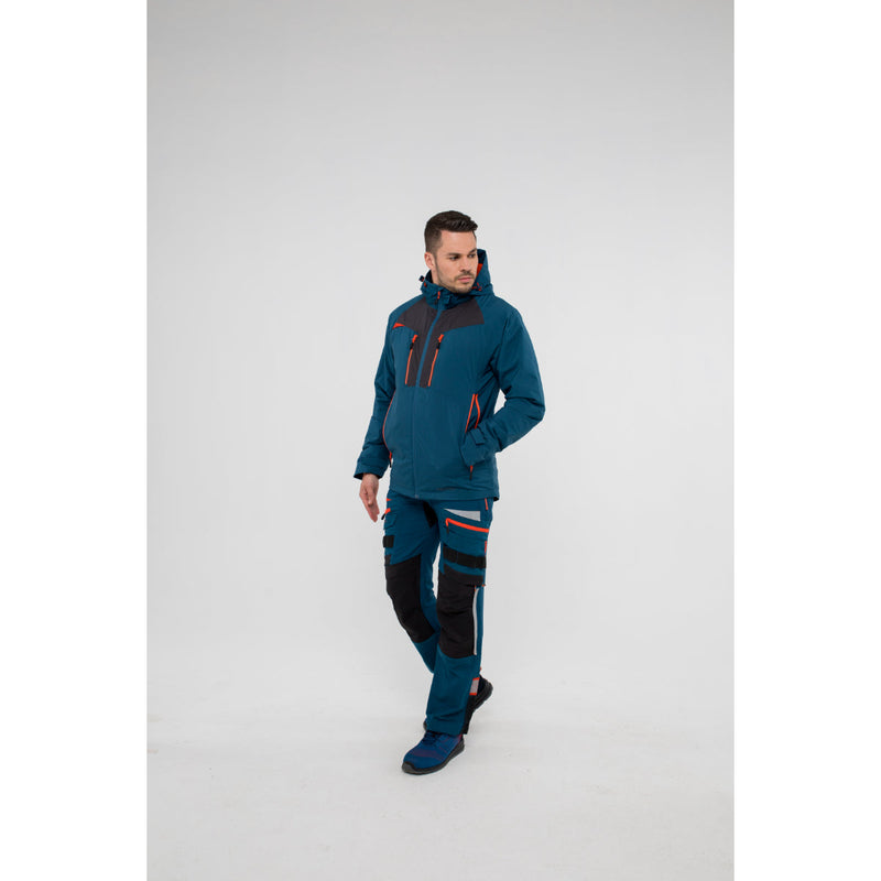 Side view of a model in the black Portwest DX4 jacket and matching work trousers.