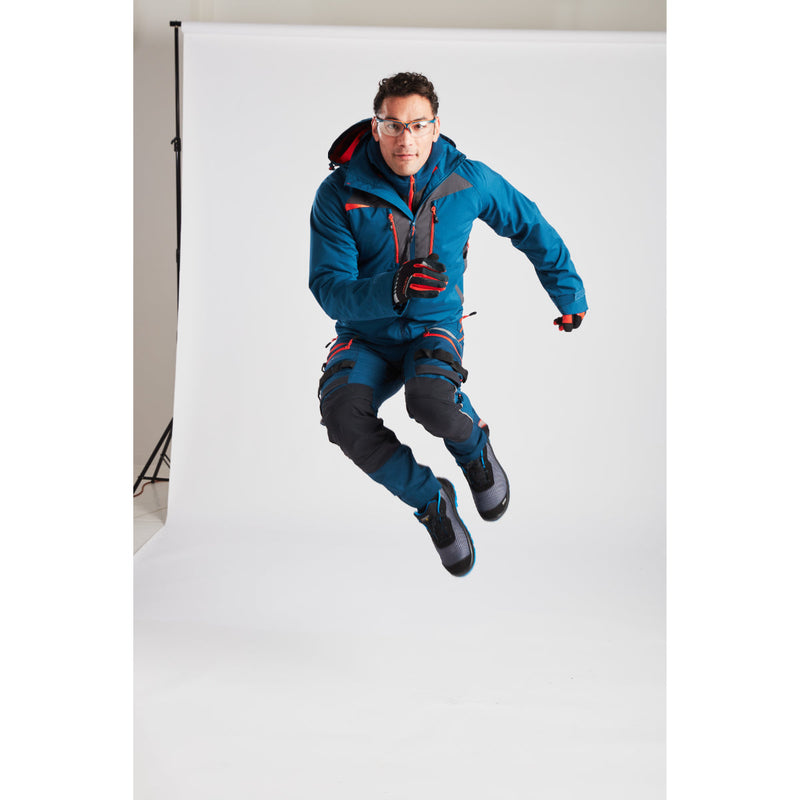 Man in Portwest DX4 Quarter-Zip Hoodie demonstrating flexibility while reaching.