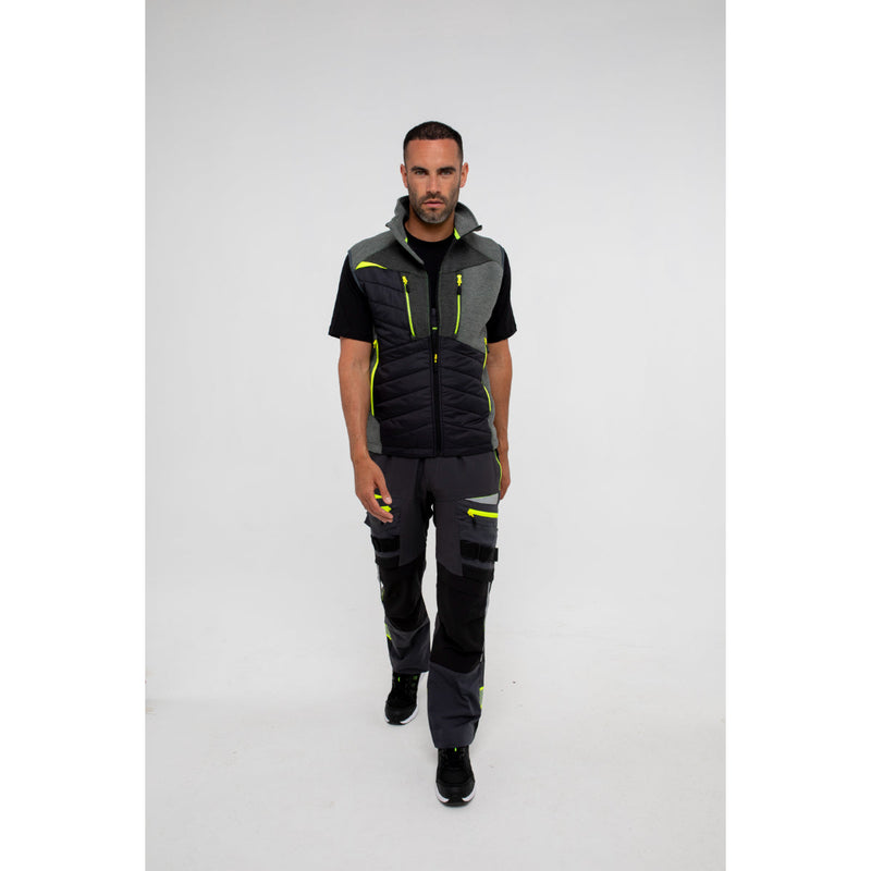 Worker showing the side cargo pocket of the trousers.