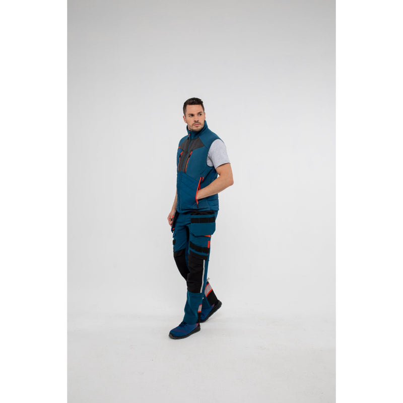 Action shot of a man in a Portwest DX4 Hybrid Baffle Gilet