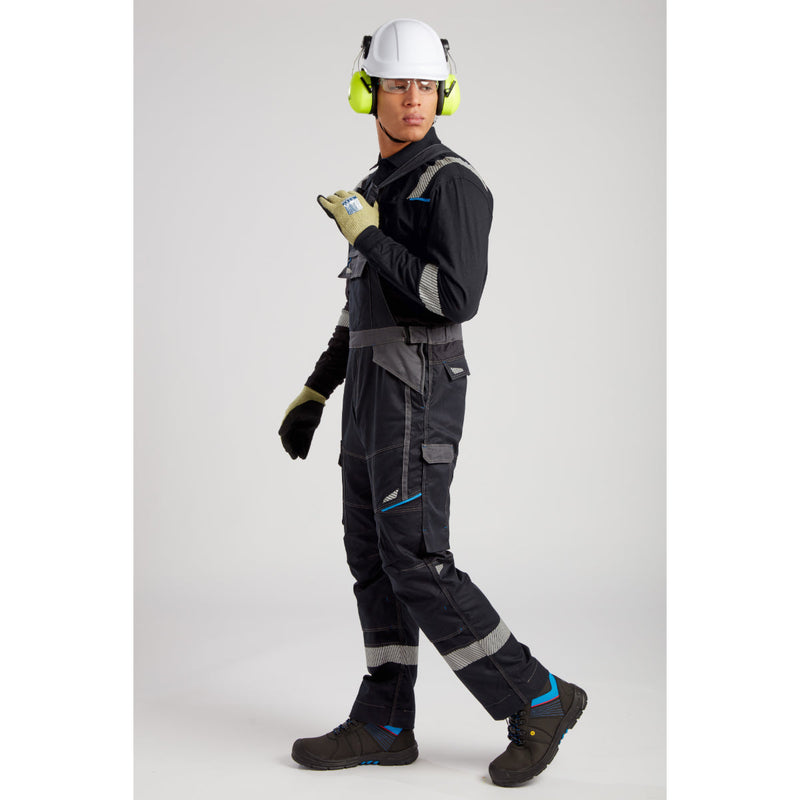 Worker in full FR gear including a Portwest helmet and face shield.