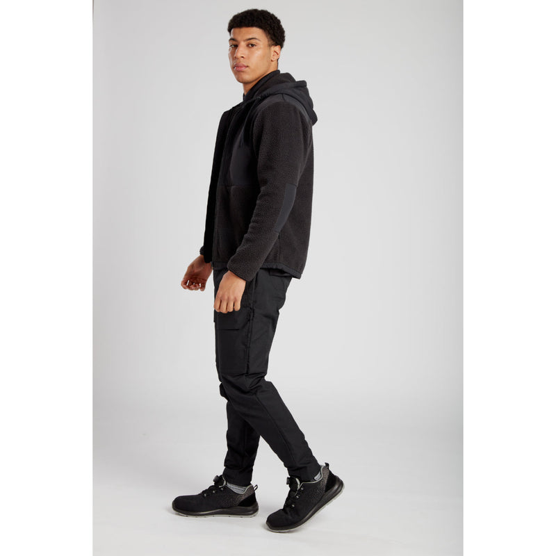 Rear view of a model in Portwest KX3 Drawstring Combat Trousers and matching jacket.