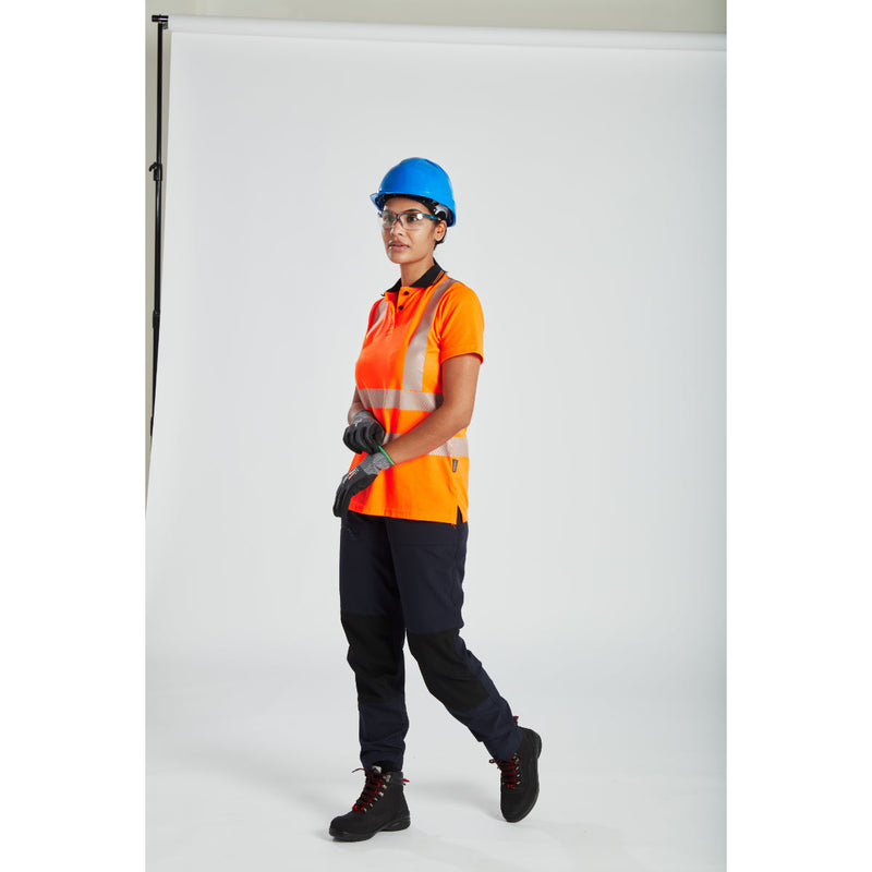 Construction worker in high-visibility gear wearing a Portwest safety helmet.