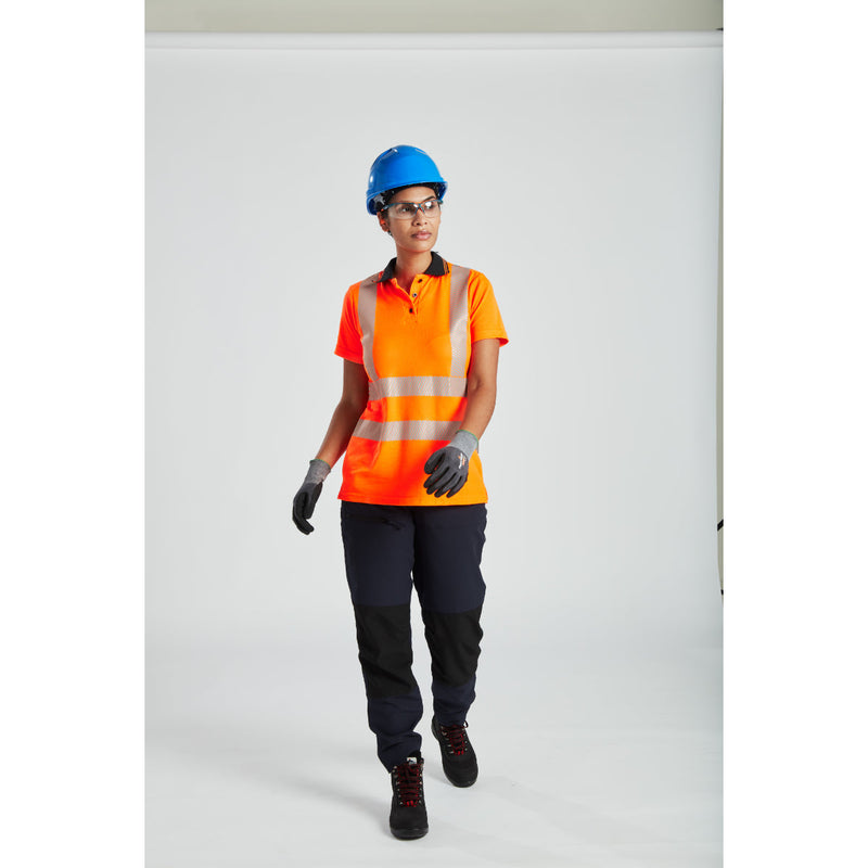 Worker wearing Portwest helmet and ear defenders while operating machinery.