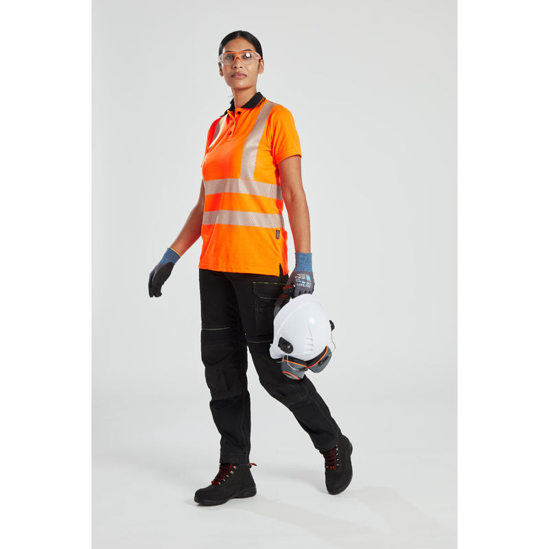 A full-body view of a model in women's Portwest workwear, with Supra KN Safety Glasses (PS10) ensuring eye safety.