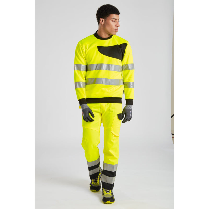 Worker in hi-vis pants wearing Portwest SG Grip15 nitrile gloves.