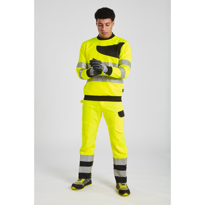 Worker in hi-vis pants with Portwest SG Grip15 nitrile gloves.