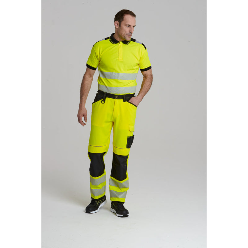 Model wearing the Portwest PW3 Hi-Vis Trouser with a matching hi-vis jacket.