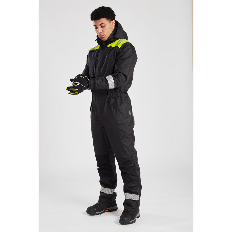 Side view of the grey and black Portwest PW3 Winter Coverall being worn by a model.
