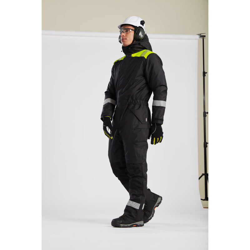 Full view of a model in Portwest workwear, helmet, and safety glasses.