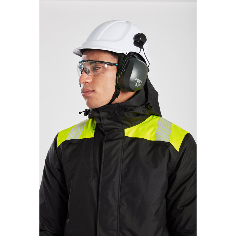 Model wearing Portwest safety gear including helmet and glasses, side view.