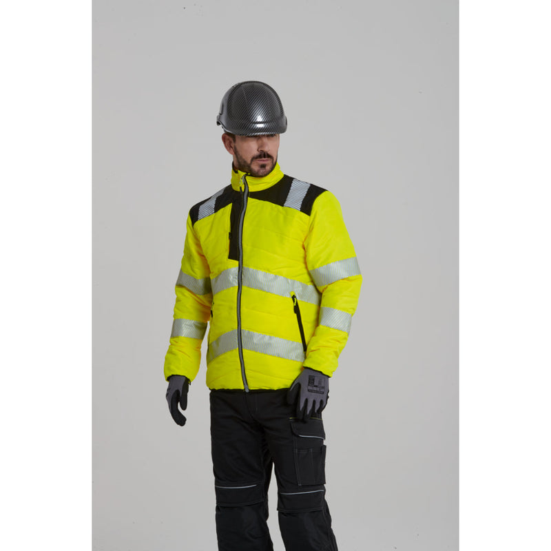 Rear view of a worker in Portwest PW3 work trousers and jacket.