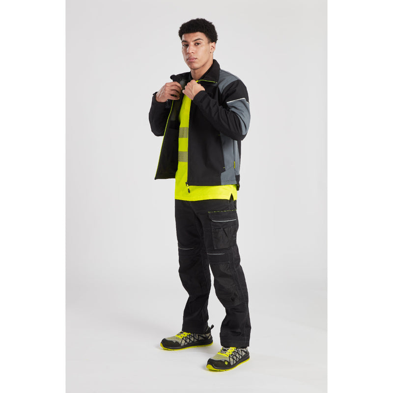 Front view of a model in the Portwest PW3 Lightweight Stretch Trouser.