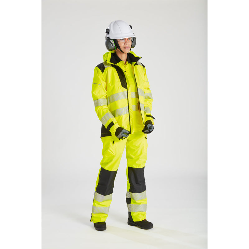 Woman wearing the yellow Portwest PW3 rain jacket with matching hi-vis workwear.