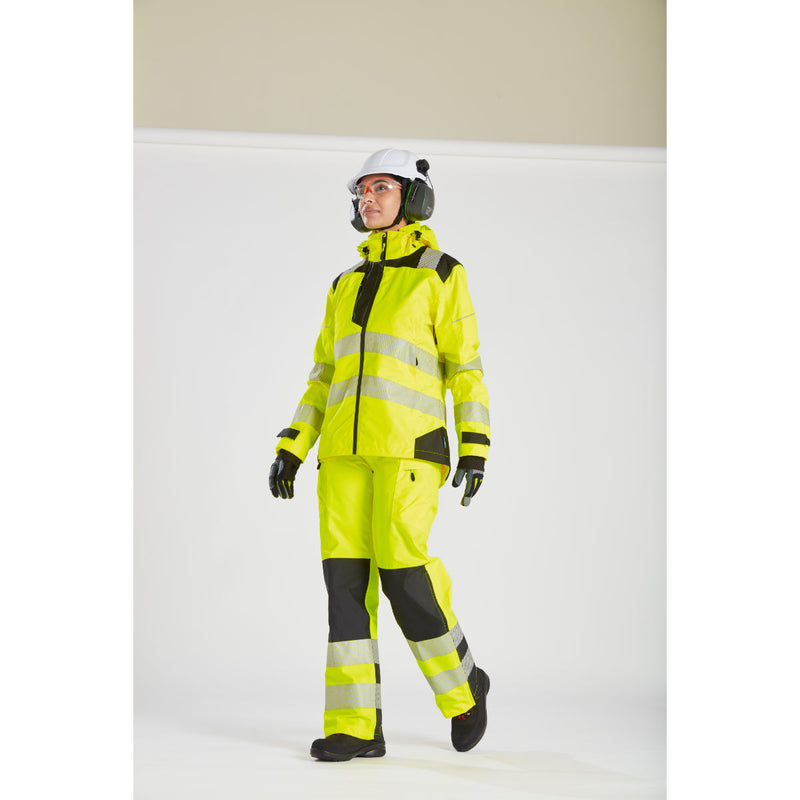 Back view of a woman in full hi-vis gear showing the yellow Portwest PW3 jacket.