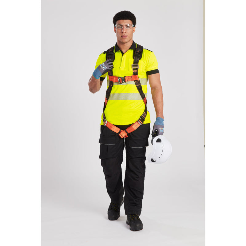 Safety equipment demonstration with harness, helmet, and lanyard on rooftop