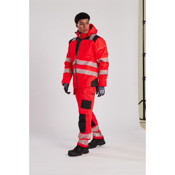 Man wearing the hi-vis winter jacket with a hard hat and safety glasses.