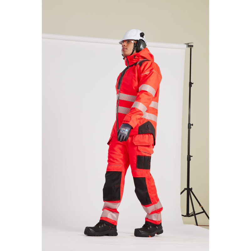 Close-up of a worker in the hi-vis winter jacket and full safety gear.