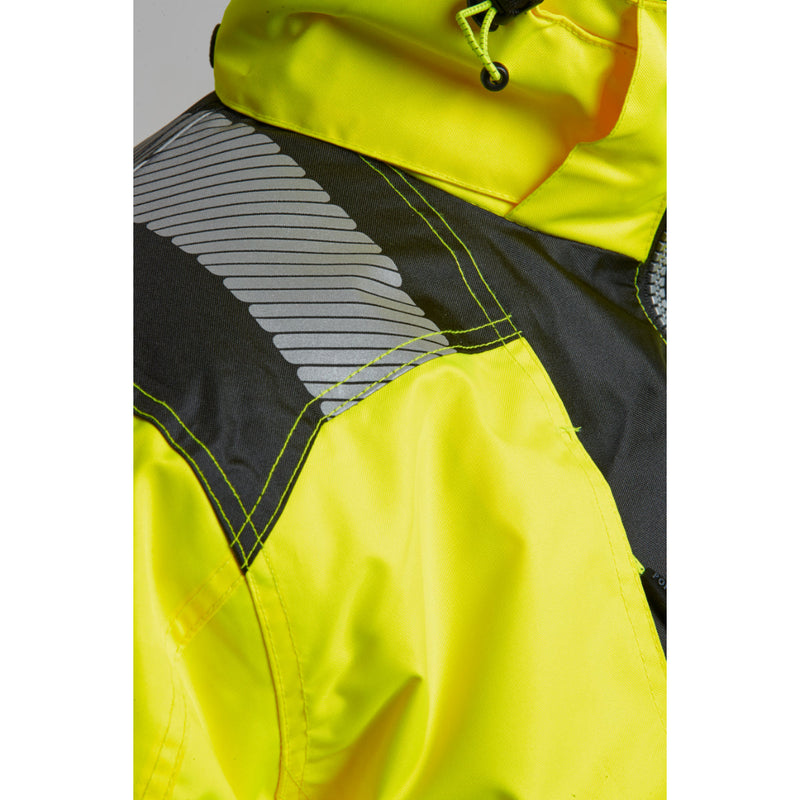Side view of a worker in full hi-vis protective gear.