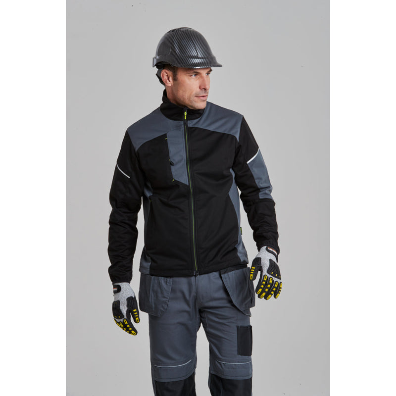 Worker wearing a hi-vis jacket, safety boots, and the PC55 carbon look helmet.