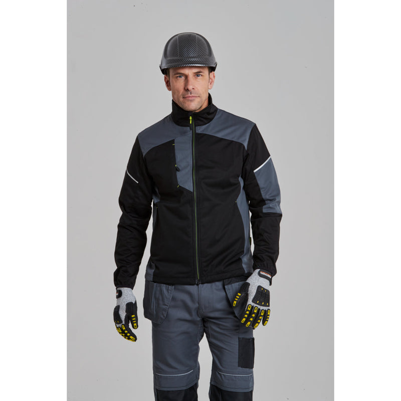 Worker wearing Portwest PW3 trousers and safety gear