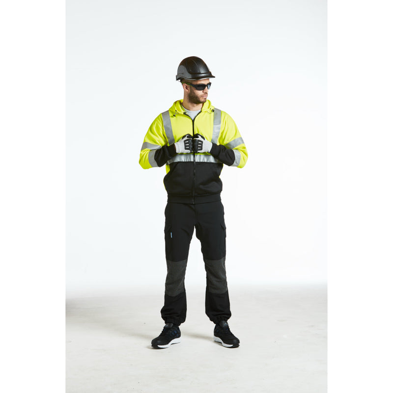 Construction worker wearing the PC55 carbon look helmet on site.