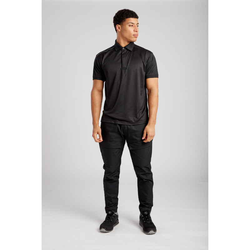 Side profile of a model walking in Portwest KX3 trousers and t-shirt.