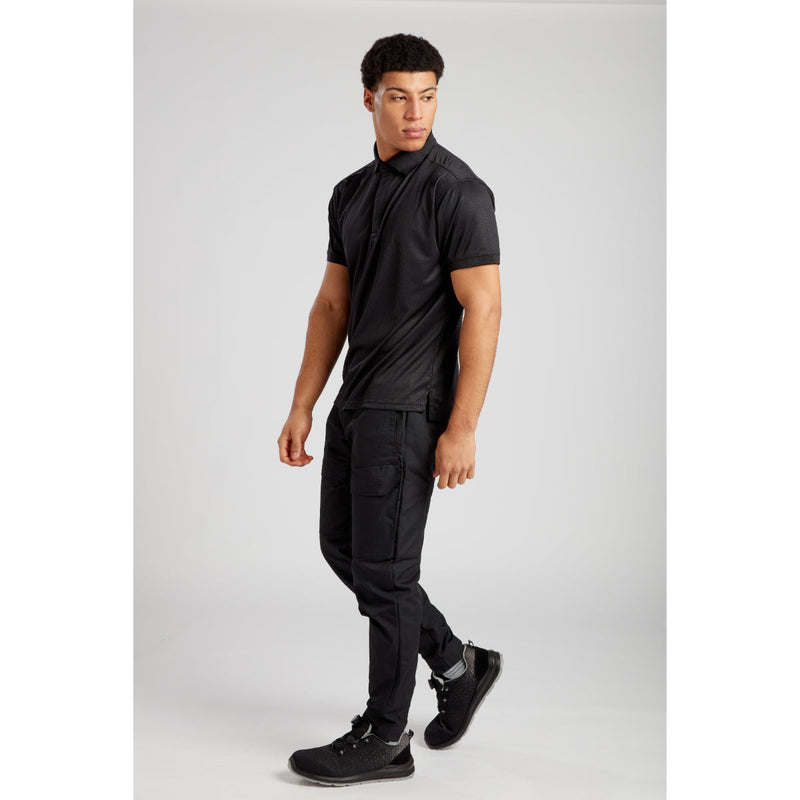 Rear view of a model in Portwest KX3 trousers, showing back pocket detail.