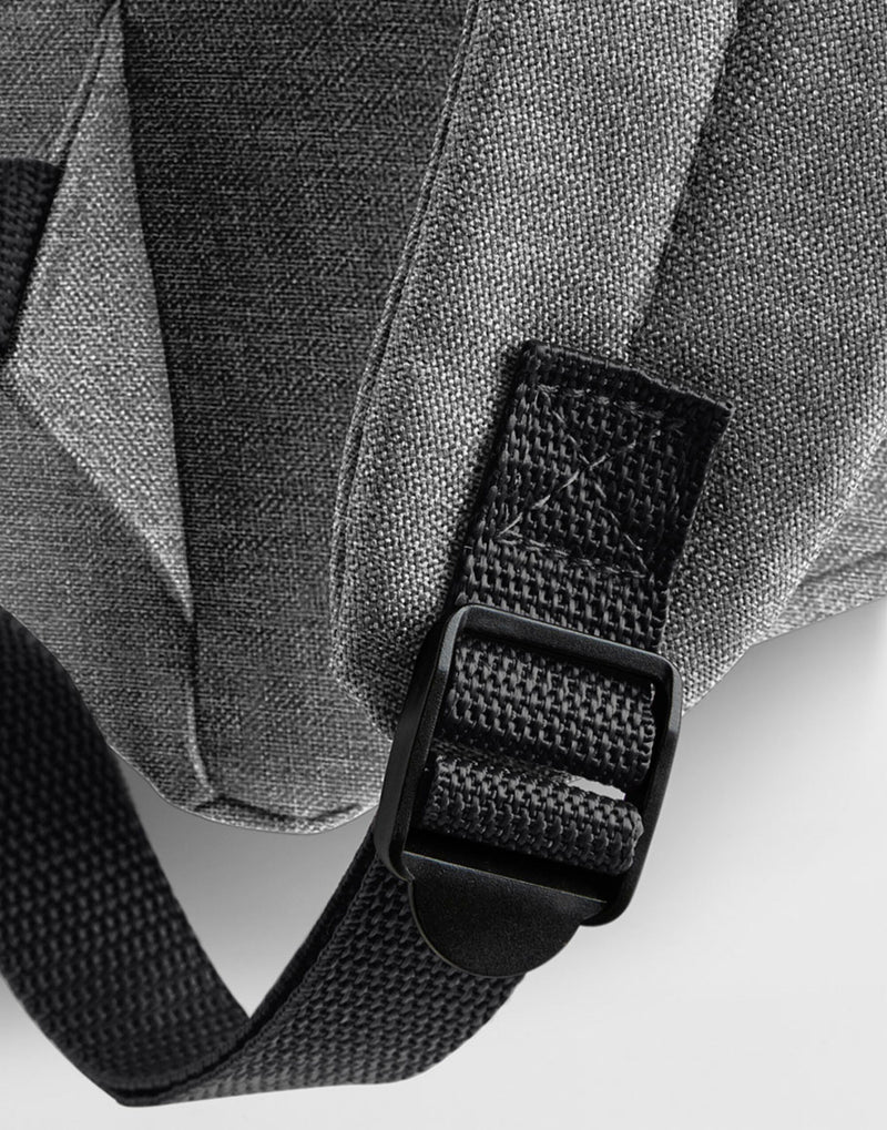 Detail of the adjustable shoulder strap on a black retro bag.