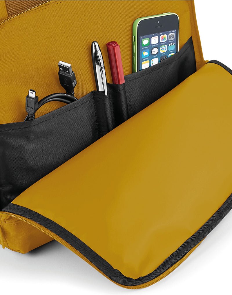 Top-down view of the twin handles on a yellow backpack.