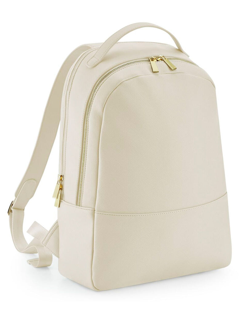 Angled view of the white boutique backpack, showing side profile.