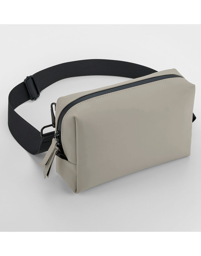 Angled view of the grey matte PU cross body bag.