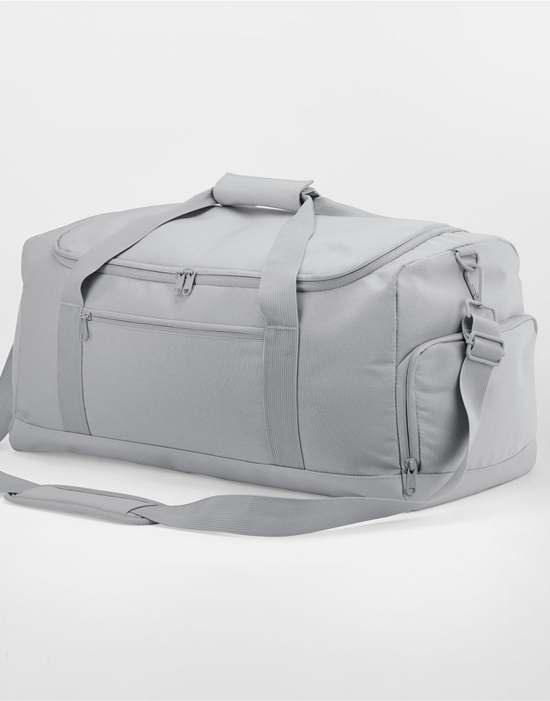The classic red Bagbase Medium Training Holdall, a vibrant and practical choice for sports.