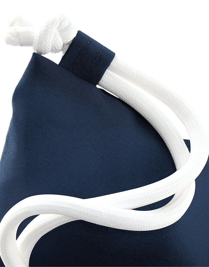 Close-up detail of the corner reinforcement on a navy blue Bagbase Icon Gymsac.