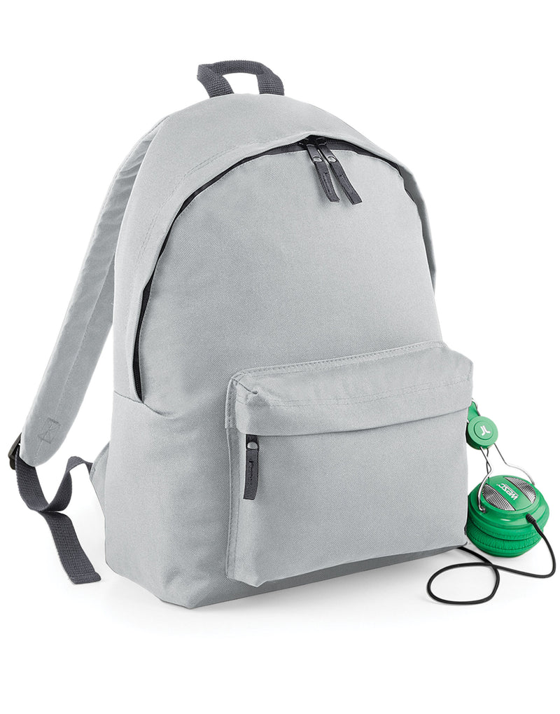 Person holding the navy Bagbase Original Barrel Bag by its handles.