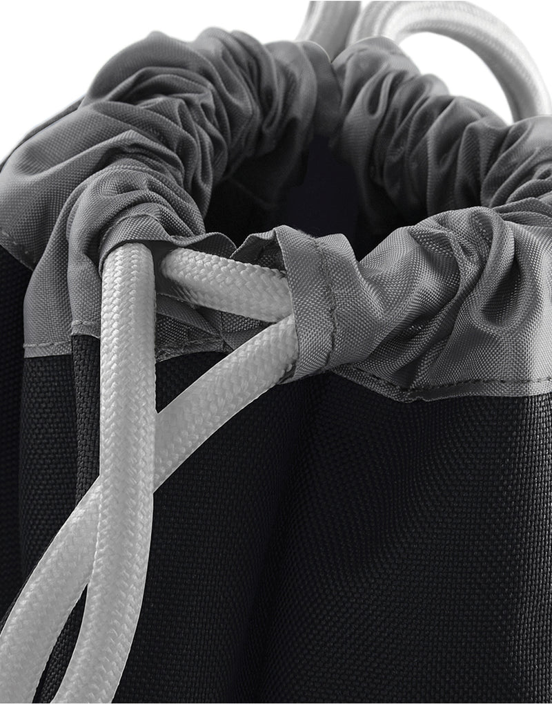 Detail shot of the zippered front pocket on the black Bagbase Athleisure Gymsac for secure, easy-access storage.