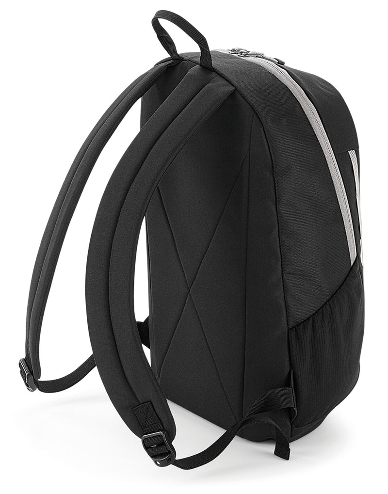 Side profile of the Bagbase Urban Trail Pack, highlighting its compression straps and mesh side pocket.