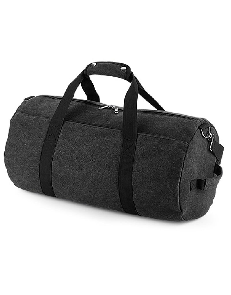 Front view of the Bagbase Vintage Canvas Barrel Bag in classic black, with contrast webbing handles.