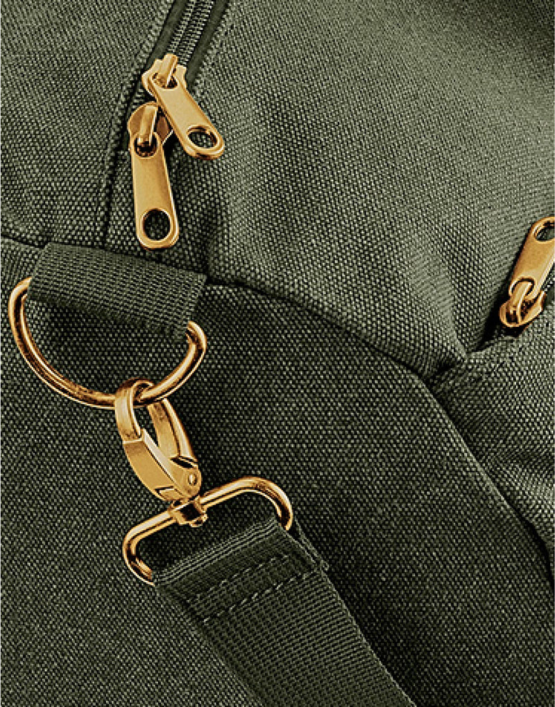 Close-up of the antique brass effect hardware on the military green Vintage Canvas Barrel Bag.